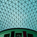 A geometric glass roof over a museum courtyard