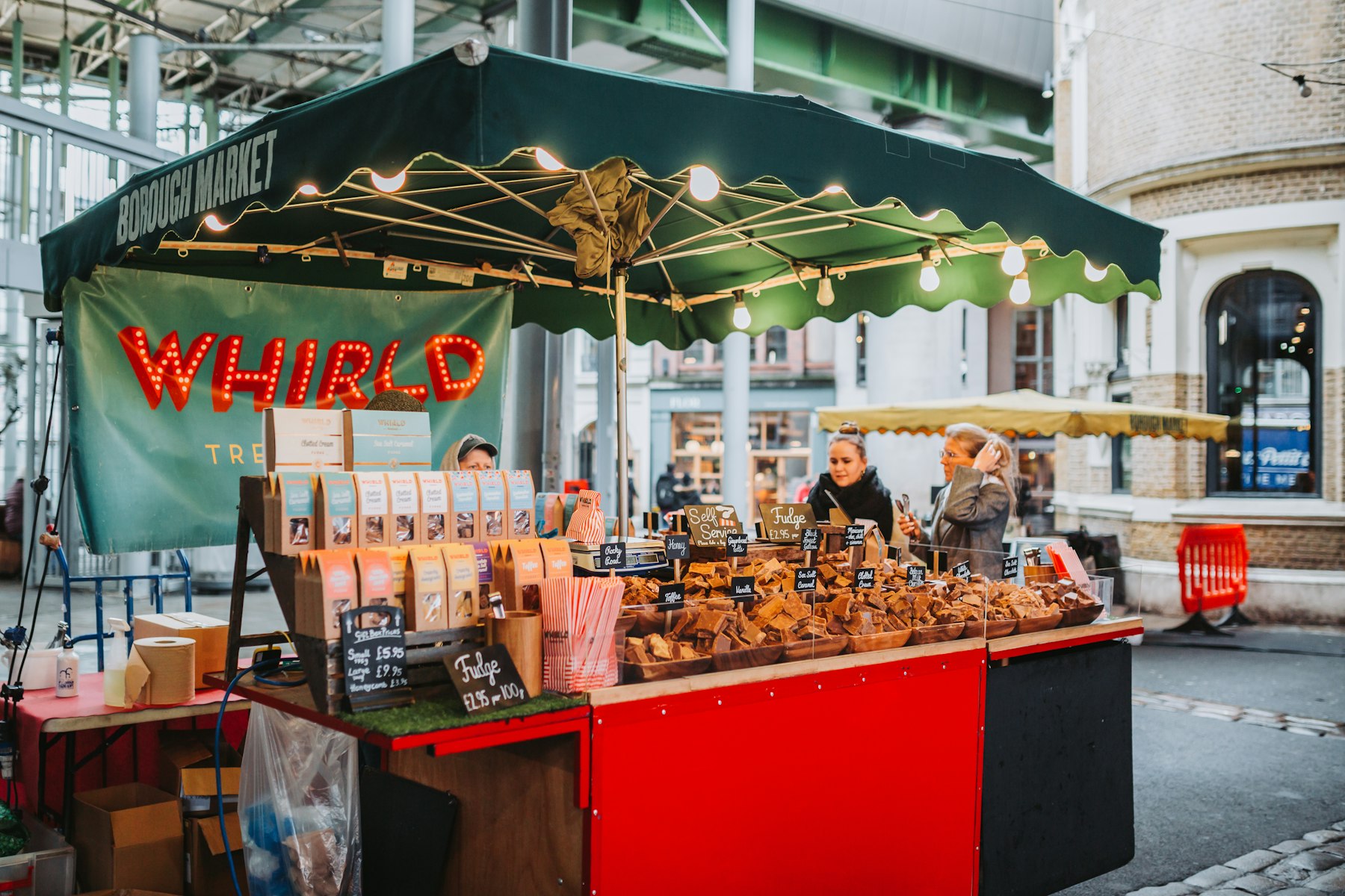 A trader serving food at a London street market