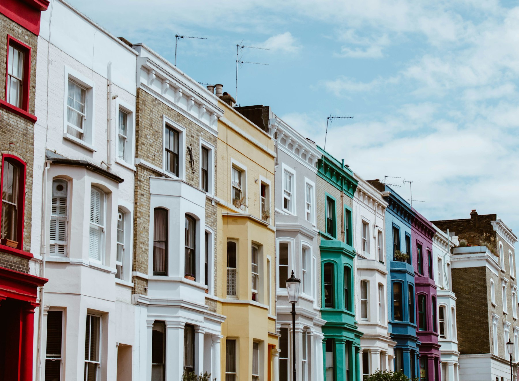 A row of colourful terraced houses in London