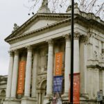 The columned entrance of Tate Britain with banners