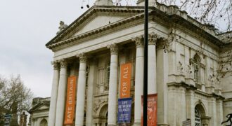 The columned entrance of Tate Britain with banners