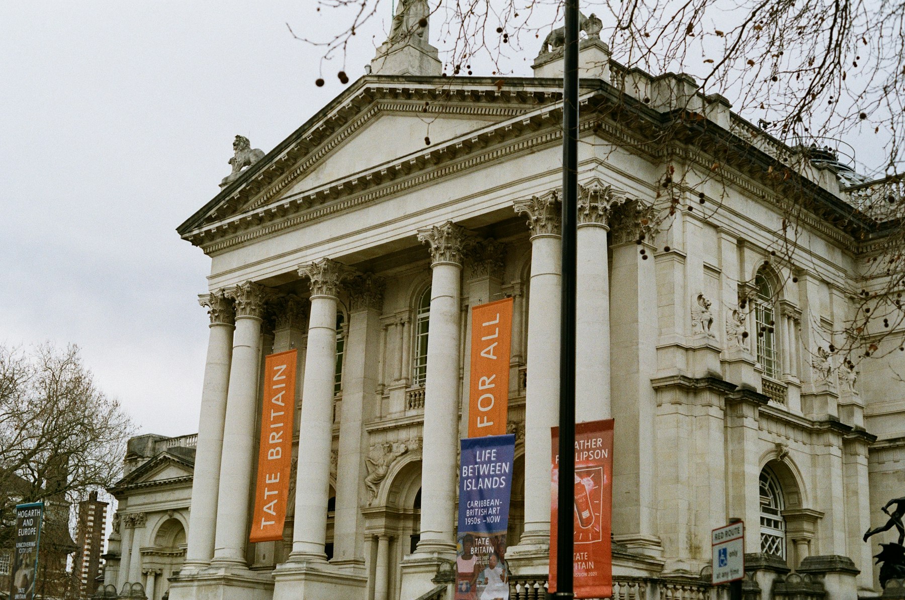 The columned entrance of Tate Britain with banners